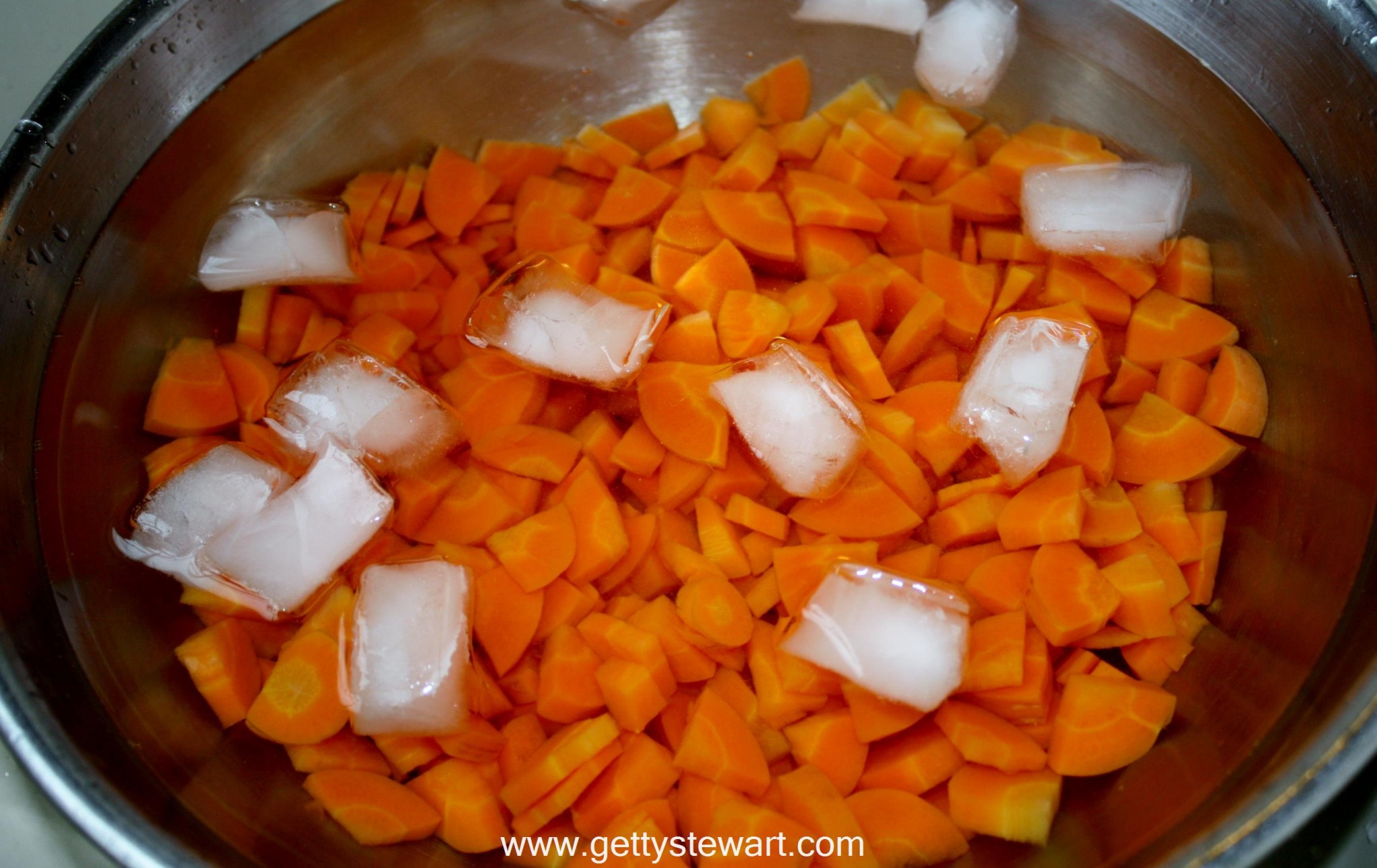 Immediately scoop out the carrots and cool them instantly in an ice ...