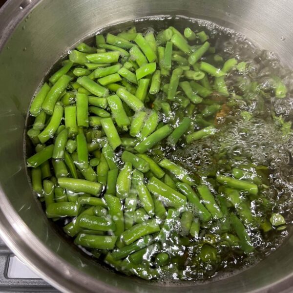 cut green beans boiling in pot