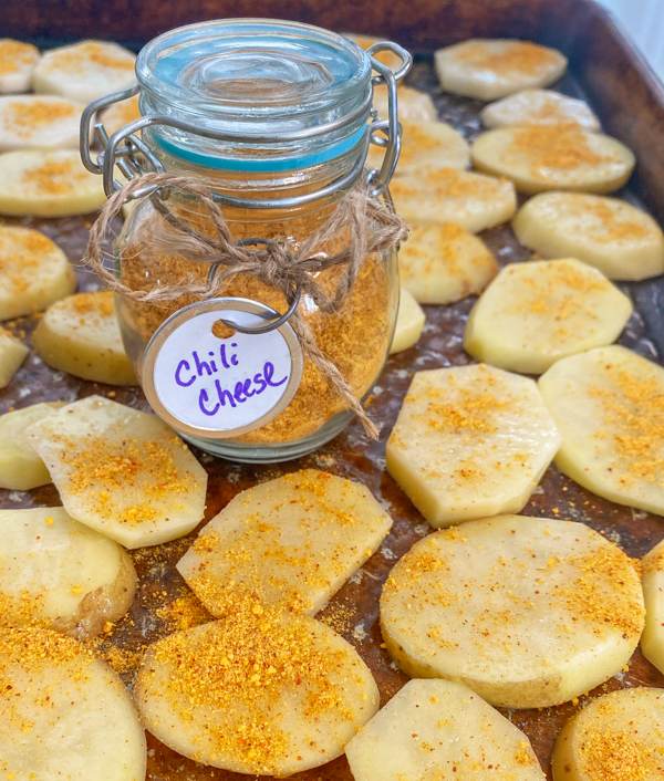 chili cheese on potatoes ready for the oven