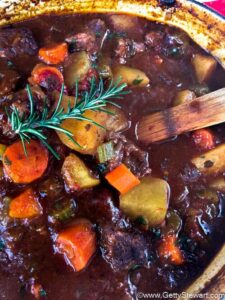 stirring stew in pot