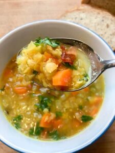 bacon lentil soup chunky on spoon
