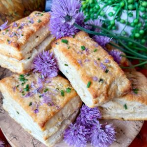 chive biscuits on board with blossoms