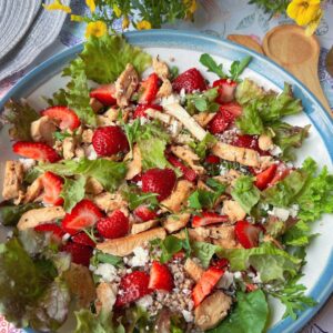 strawberry basil salad with buckwheat and chicken on platter