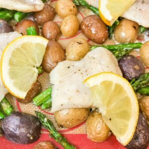 finished pickerel with lemon and asparagus