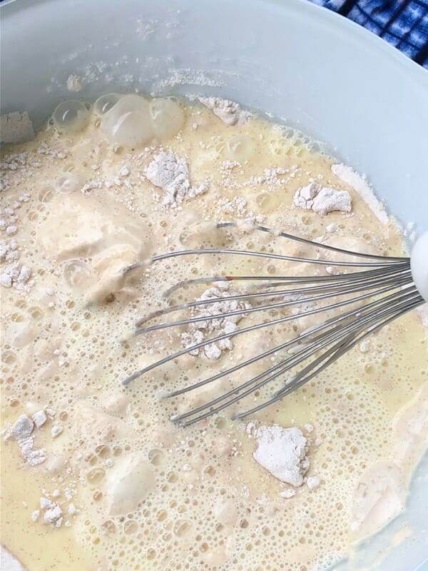 whisking wet and dry ingredients together, just until mixed.