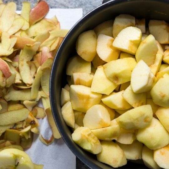 peeled sliced apples in pot