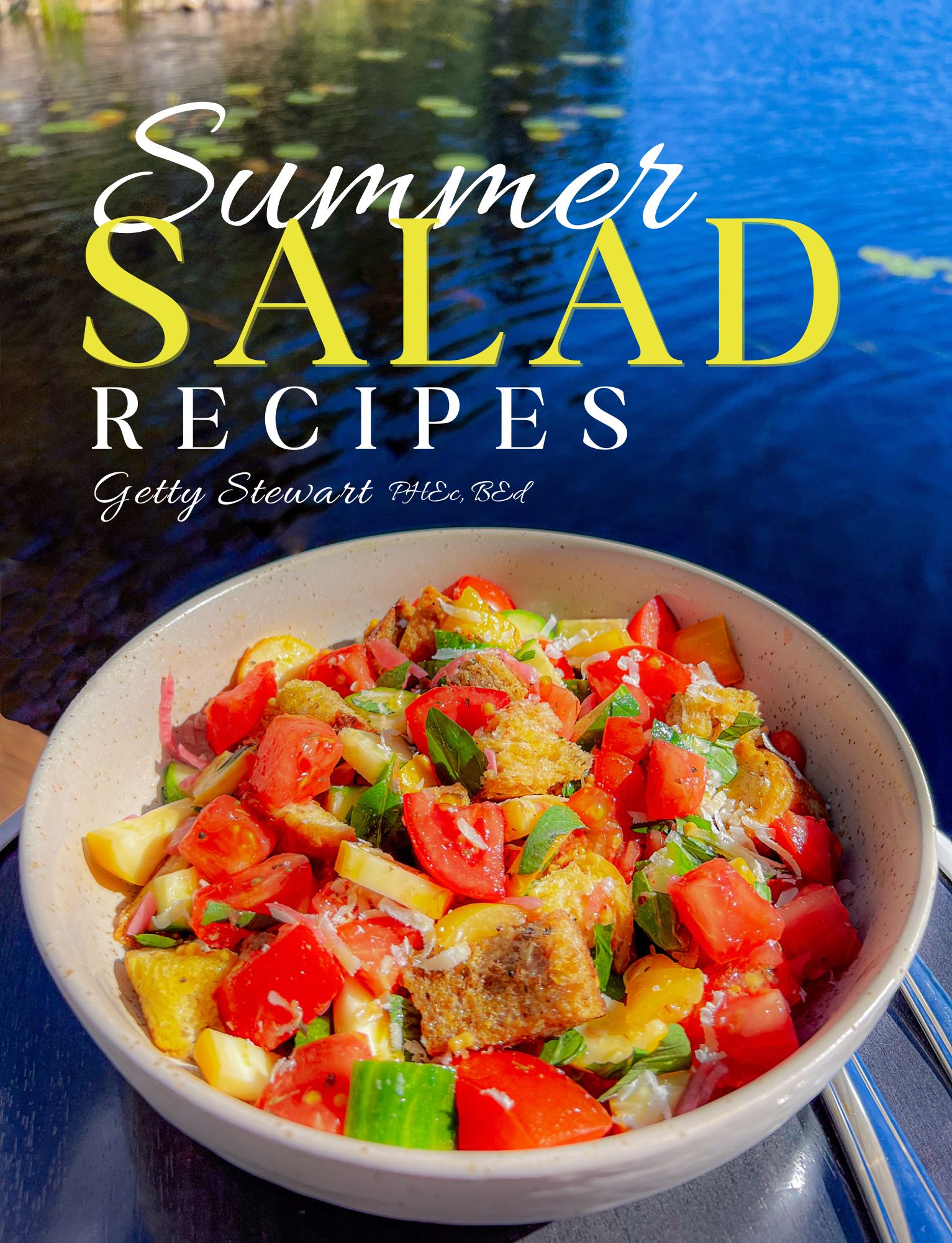 cover of summer salads book with bowl of panzanella near water