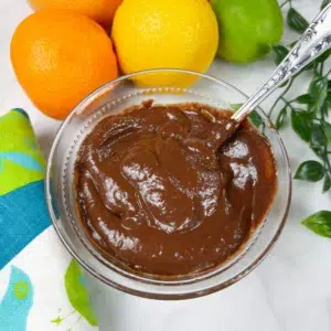 chocolate avocado sauce in bowl next to citrus