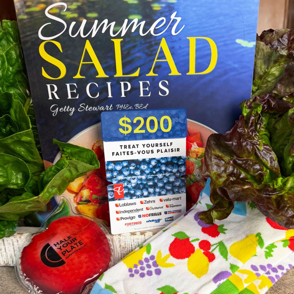 summer salad book cover with $200 loblaws gift card, apple shaped ice pack and fruity socks surrounded by lettuce